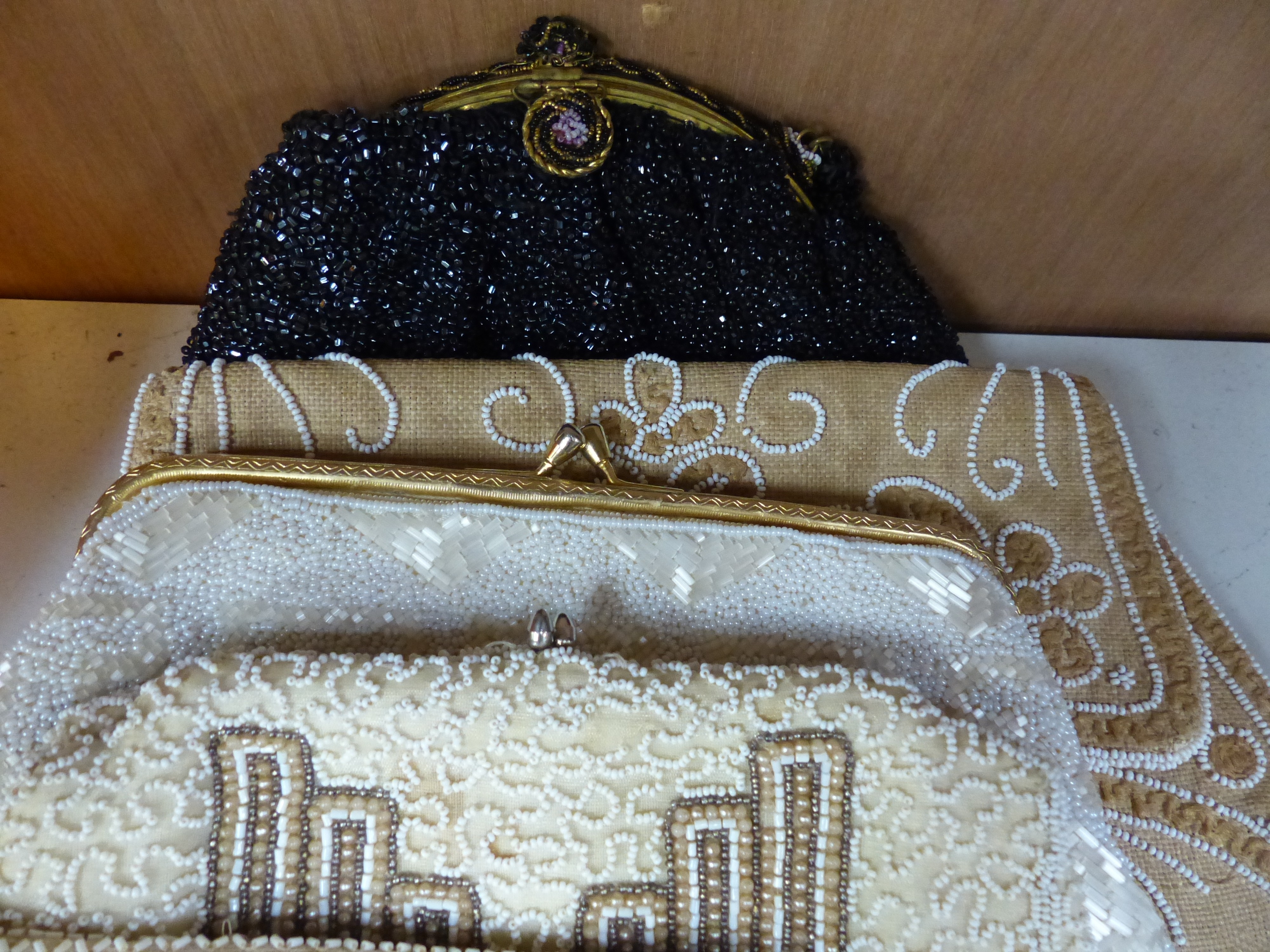 Ten beaded evening bags, a pouch and miser's purse and a metal purse